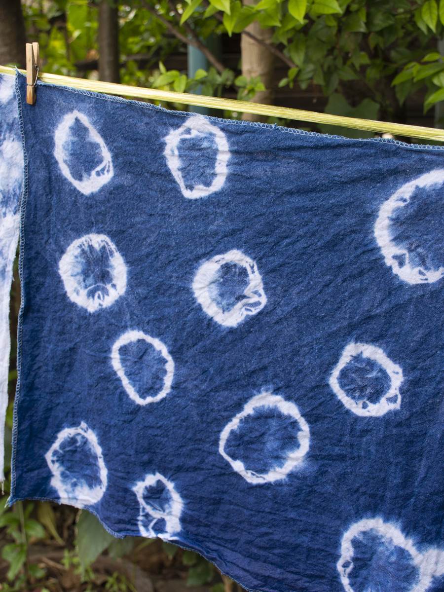 Indigo-dyed shibori cloth drying outdoors
